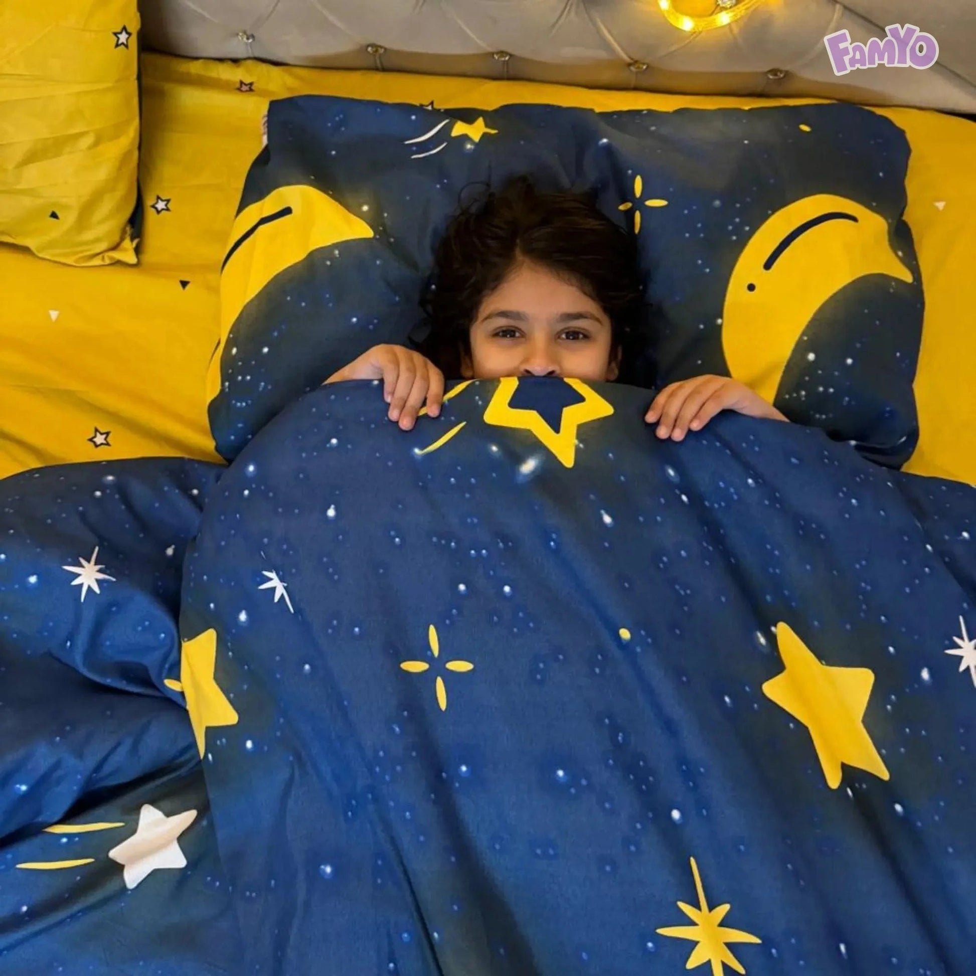 Reversible comforter in Moon and Stars design with blue and yellow accents, providing versatile decor options