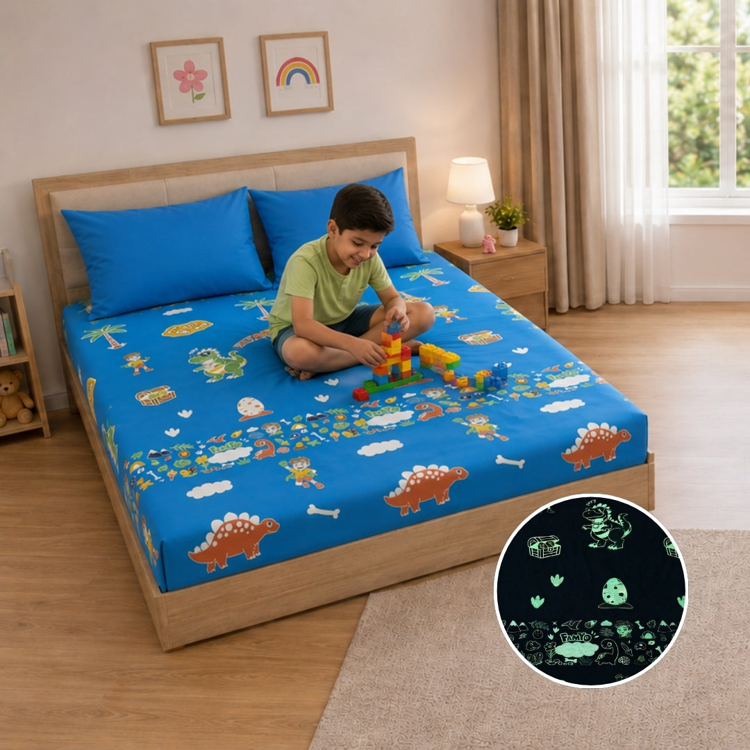 Pack of 2 Rexy the Dino glow bedsheet sets for kids featuring king-size fitted bedsheets, matching pillow covers, premium 300 TC cotton-blend microfiber, glow in the dark design, breathable comfort, elastic corners, and child-safe materials.