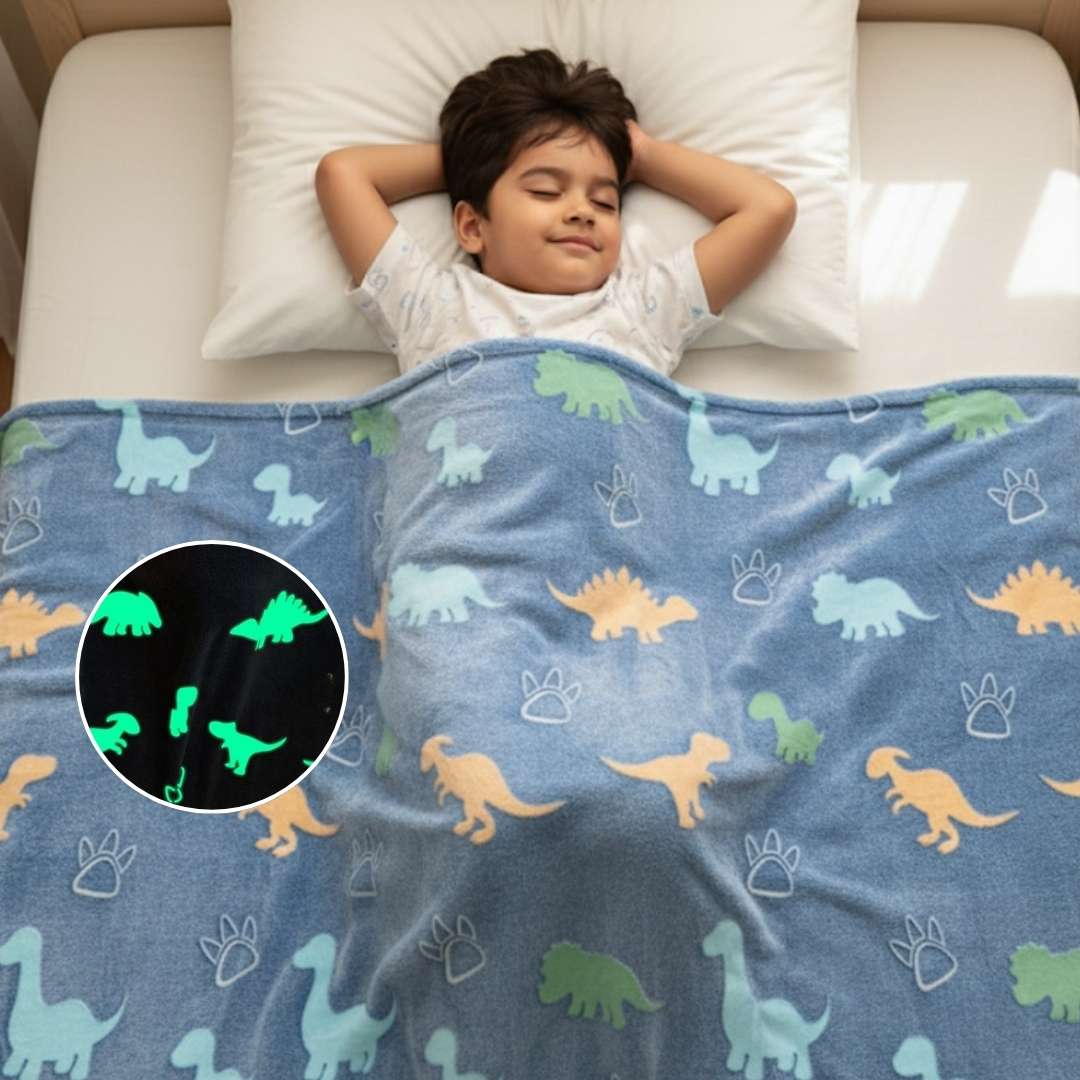Child lying on a bed with a dinosaur-patterned blanket, including a close-up of glowing dinosaurs.