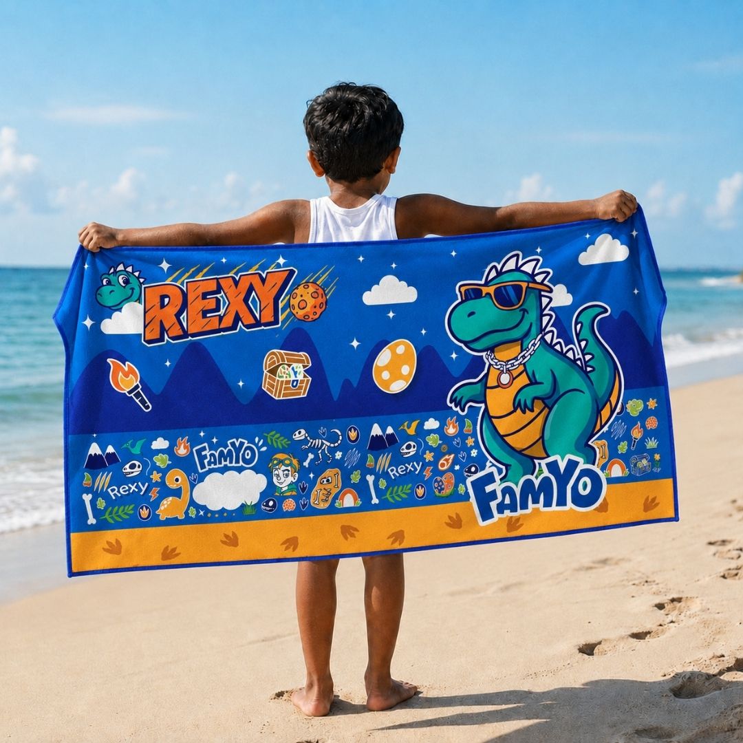 Rexy the Dino kids towel featuring soft quick-dry terry fabric, lightweight absorbent design, 70 × 140 cm size, and ideal for bath, beach, pool, swimming, travel, and everyday use.