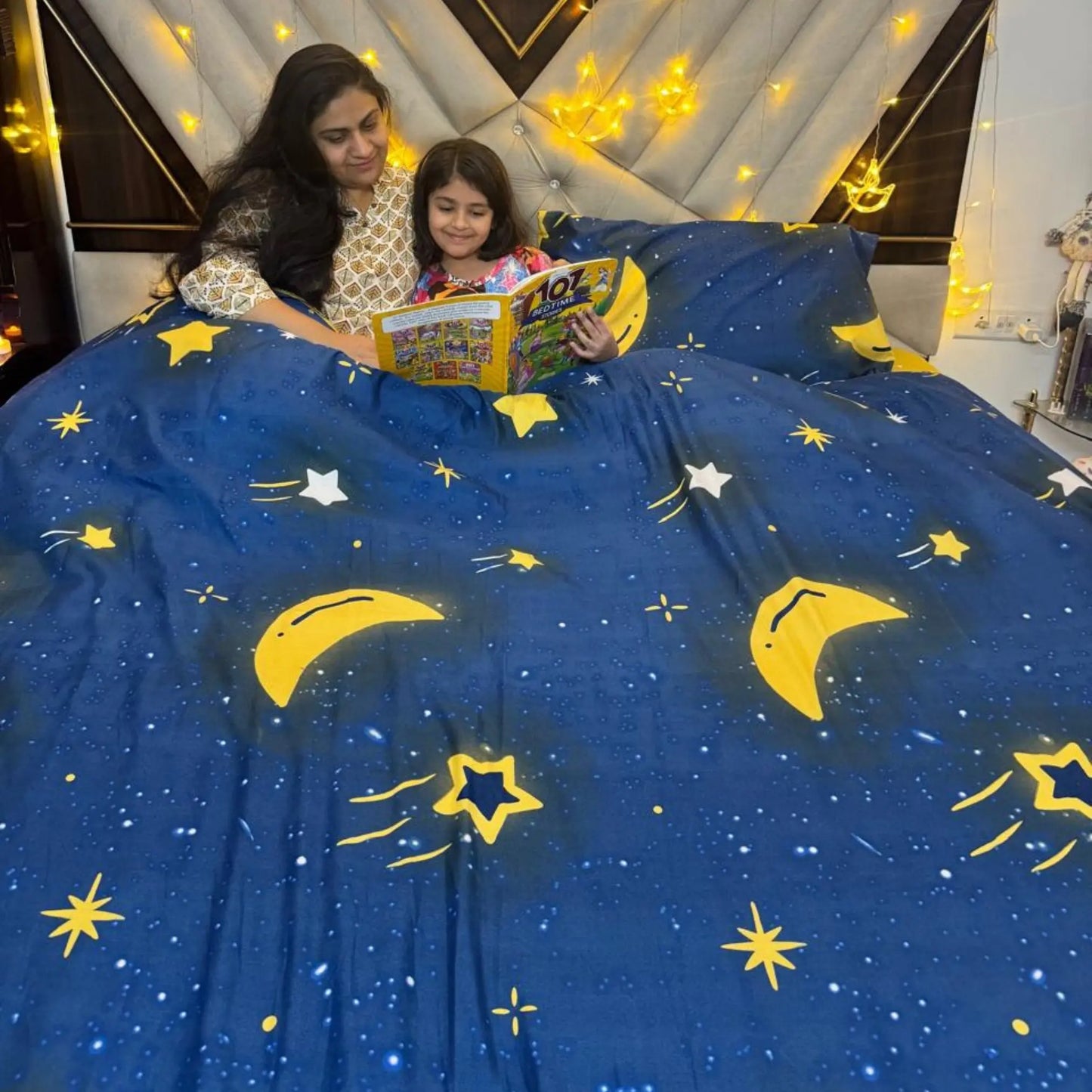 Child wrapped in the Famyos+'s Moon and Stars comforter, enjoying its soft and cozy warmth