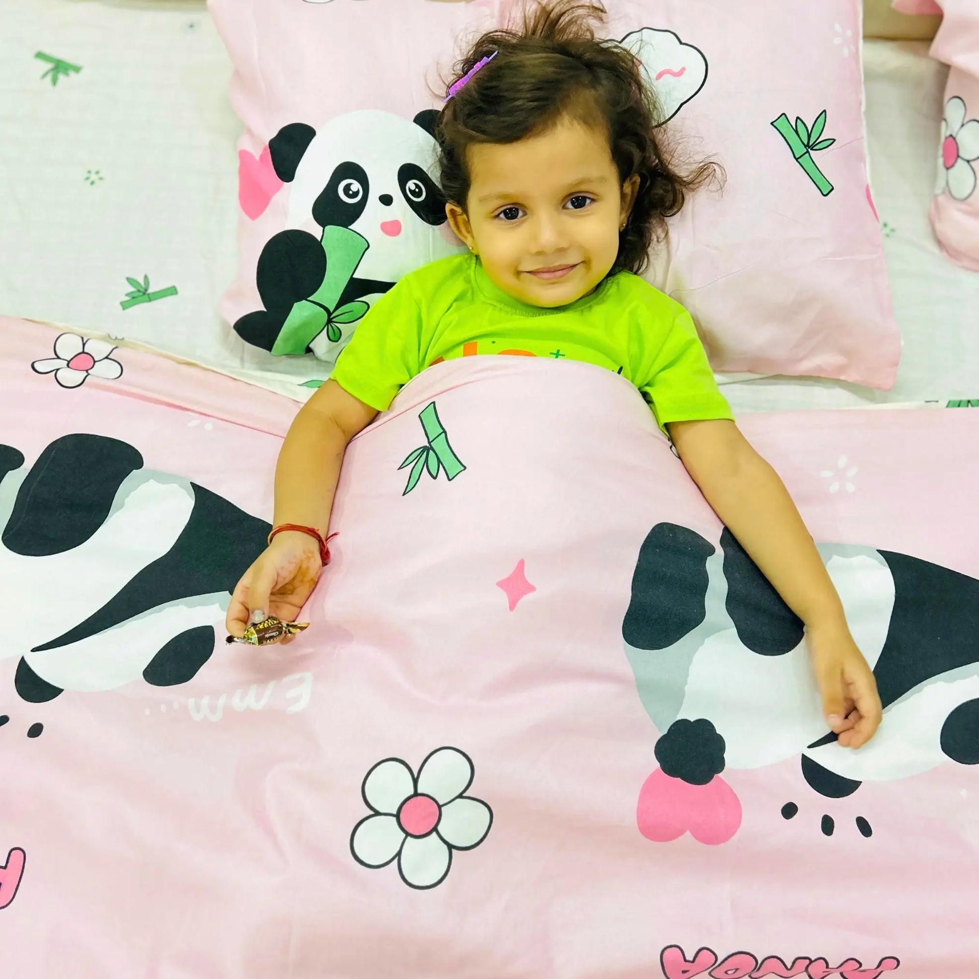 Neatly made bed with FAMYO's Sleepy Pink Panda for Polished and Stylish kids' Bedroom Decor 