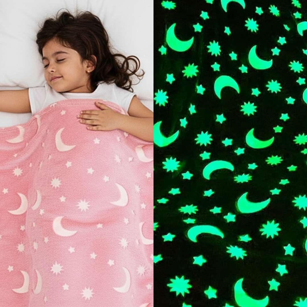 Girl sleeping under a pink Famyo glow-in-the-dark blanket with moon and star patterns, shown glowing green in the dark.
