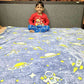 Kids space blanket – glowing astronaut print for dreamy bedtime