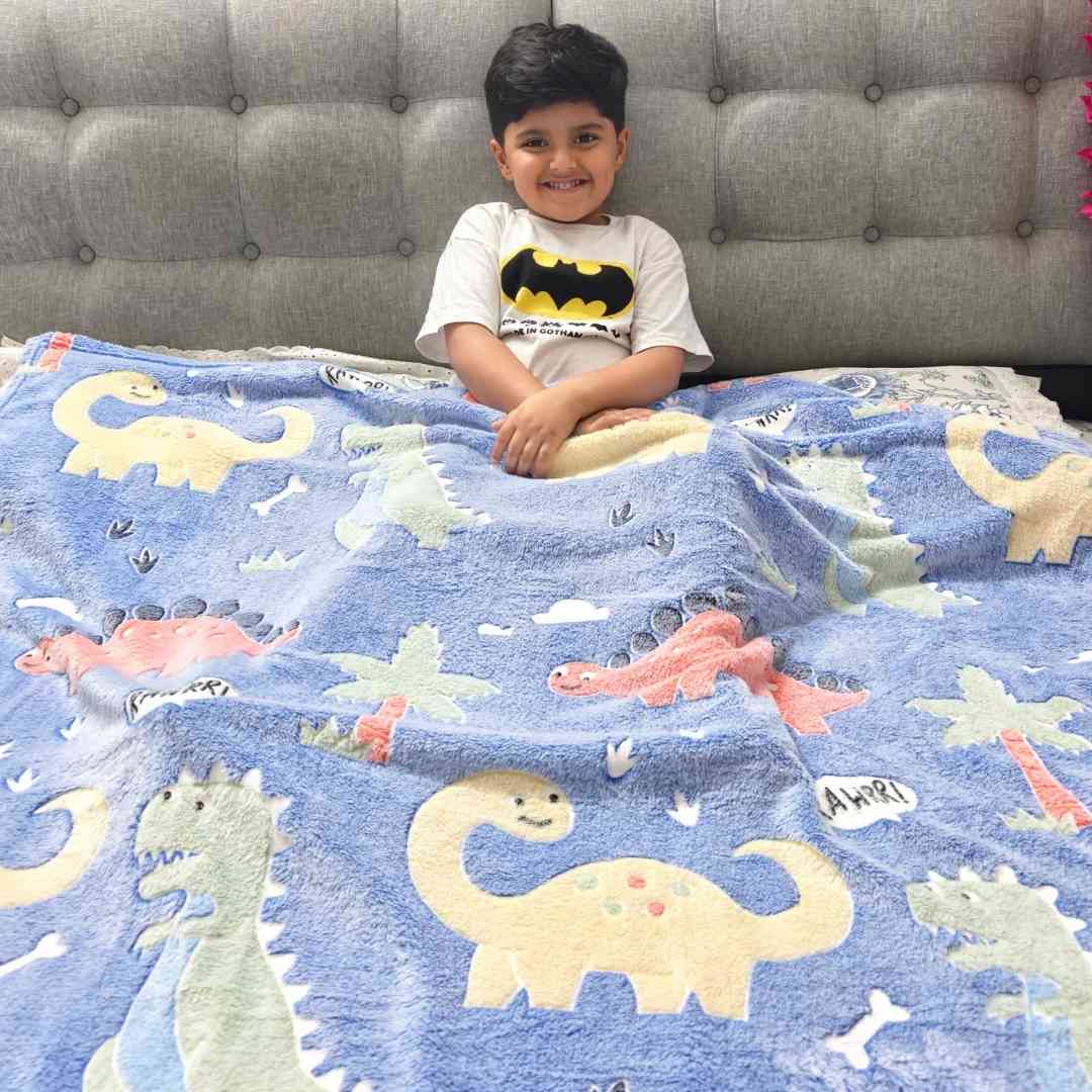 Kids glow blanket – blue dino theme with stars that light up at night