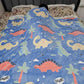Famyo breathable glow blanket – blue dino print for ages 0–15