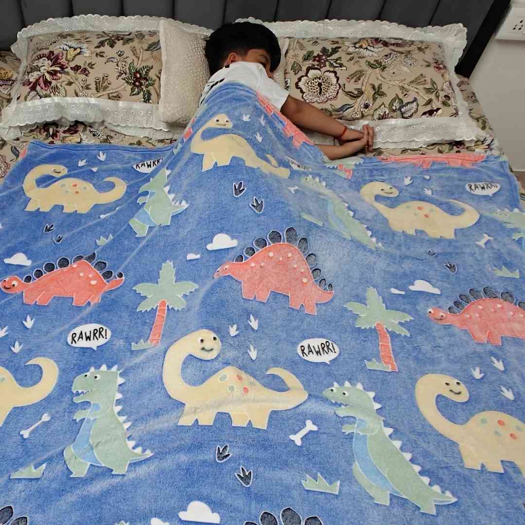 Glow in dark blue dino blanket – perfect AC blanket for boys and girls