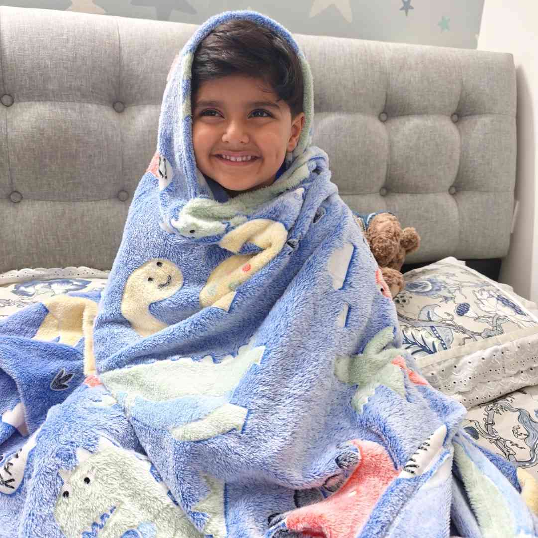 Blue dino AC blanket for kids – glowing dinosaur design for bedtime magic