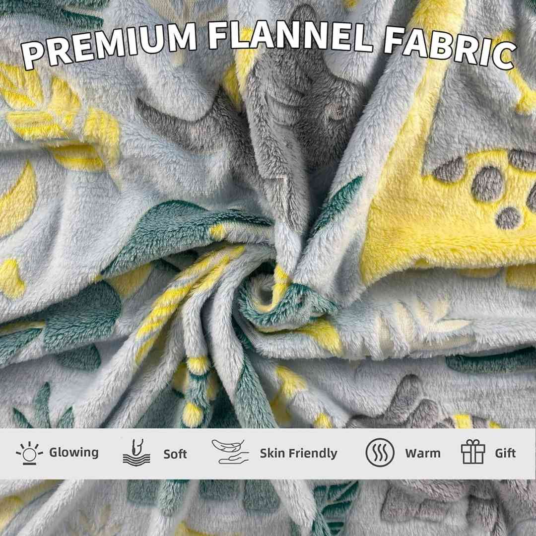 Famyo breathable glow blanket – green dino print for 0–15 year olds