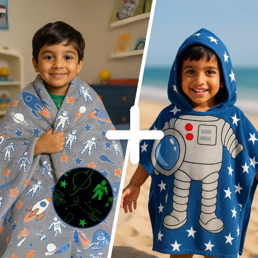 Two children wearing space-themed ponchos, one gray with space patterns and the other blue with an astronaut design.