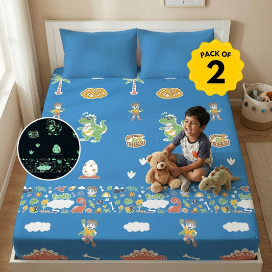 Pack of 2 Rexy the Dino glow bedsheet sets for kids featuring king-size fitted bedsheets, matching pillow covers, premium 300 TC cotton-blend microfiber, glow in the dark design, breathable comfort, elastic corners, and child-safe materials.